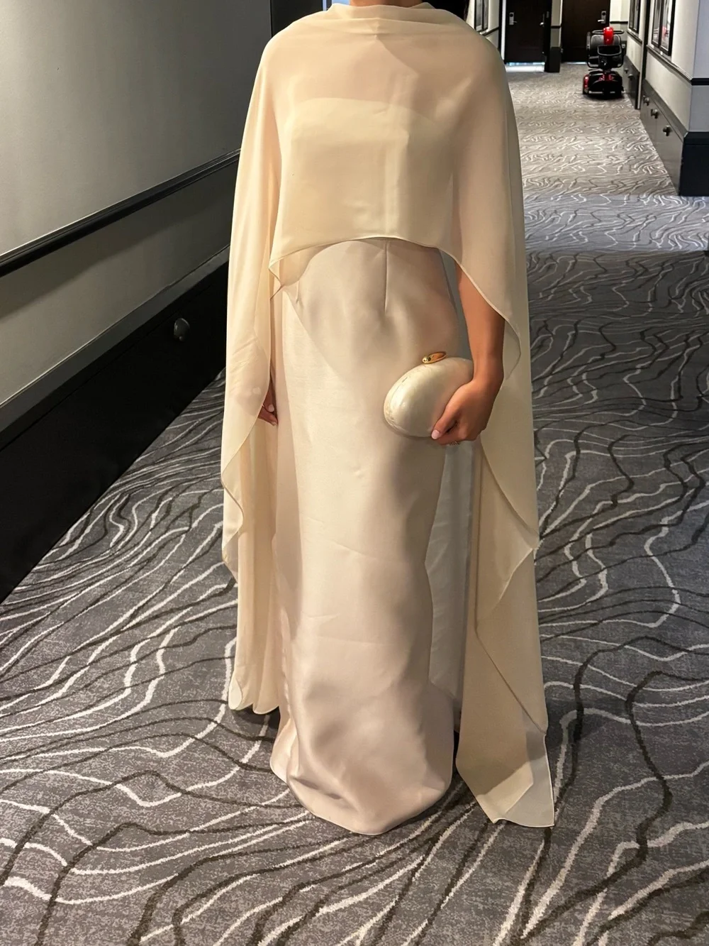 Elegant Cream Cape and champagne strapless Gown